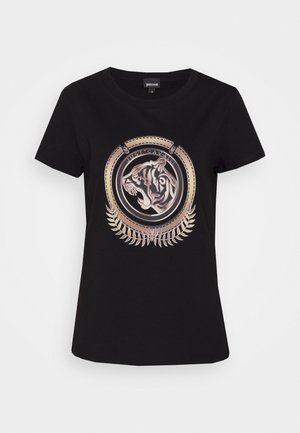 Schwarzes kurzärmeliges T-Shirt mit einem metallischen goldenen und silbernen Tigerkopf-Emblem in einem kreisförmigen Rahmen und Blattdetails darunter.
