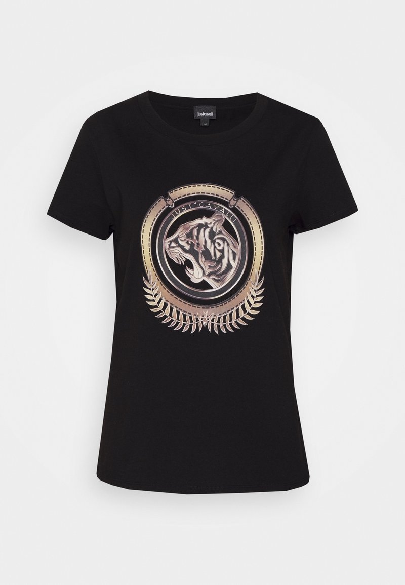 T-shirt noir à manches courtes avec un emblème tête de tigre métallique or et argent à l'intérieur d'un cadre circulaire et des détails de feuilles en dessous.