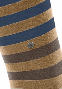 Skarpetki w paski z wzorem niebieskich, brązowych i beżowych pasków. Wyraźnie teksturowany materiał z metalowym logo wszytym z boku.