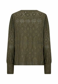 Maglietta verde oliva a maniche lunghe con un intricato design in pizzo caratterizzato da ritagli a forma di diamante e ovale. Texture morbida con maniche arricciate.