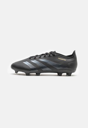 Black soccer cleat with blue diagonal stripes, lace-up design, textured synthetic material, and studded rubber sole for traction.