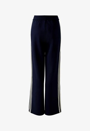 Navy blue wide-leg pants with an elastic waistband, featuring white side stripes and a single back pocket. Soft fabric texture.