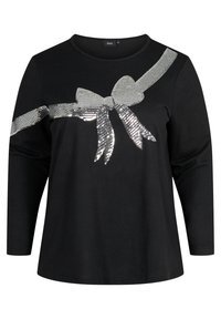 Schwarzes Langarm-T-Shirt mit einem metallisch silbernen Pailletten-Bow-Design auf der Vorderseite. Weicher Stoff mit Rundhalsausschnitt und normaler Passform.