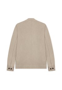 Μπεζ λινό σακάκι με κομψό σχεδιασμό, που διαθέτει μινιμαλιστική πλάτη, μακριά μανίκια και δύο μαύρα κουμπιά σε κάθε μανσέτα.