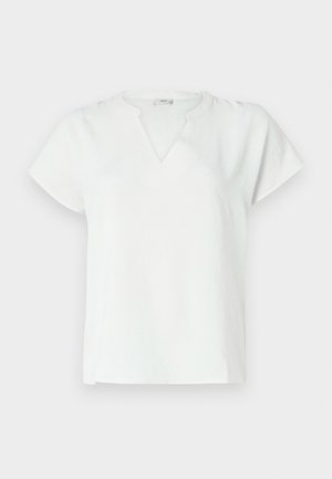 Haut blanc à manches courtes avec un décolleté en V, fabriqué dans un tissu texturé, présentant une coupe décontractée et des détails de coutures subtils.