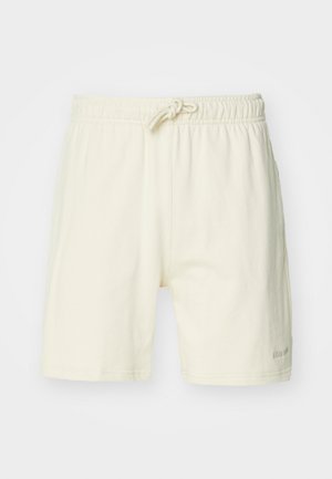 Lichtbeige katoenen shorts met een elastische tailleband en trekkoord. Kenmerkt zich door een eenvoudig ontwerp en een rechte snit. Accentuated met een klein tekstlogo.