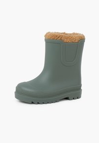 Stivale alla caviglia verde in gomma con fodera in pelliccia sintetica color tana, suola texturizzata e finitura liscia. Presenta un lato rinforzato per facilitarne l'indossamento.