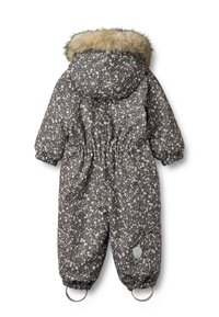 Donkergrijs sneeuwpak met bloemenpatroon, voorzien van een met bont afgezoomde capuchon, elastische taille en geribbelde mouwen. Voorzien van twee lussen bij de enkels voor een veilige pasvorm.