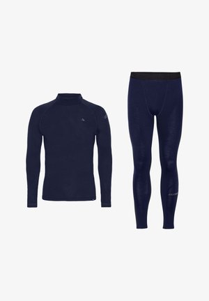 Set di base layer termico blu navy, composto da un top a maniche lunghe con collo alto e leggings con vita elastica e dettagli logo.