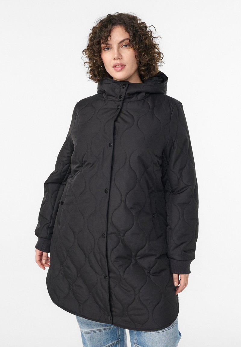 Black quilted coat featuring a hood, snap buttons, and side pockets. The fabric has a smooth texture and a slightly glossy finish.