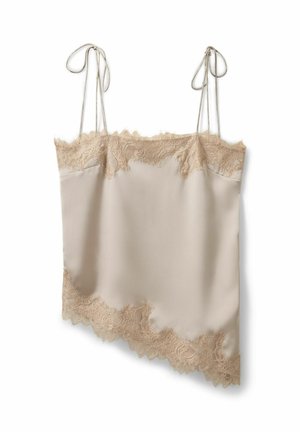 Camisole in raso beige con rifinitura in pizzo lungo la parte superiore e orlo asimmetrico, caratterizzata da sottili spalline regolabili annodate a fiocco.