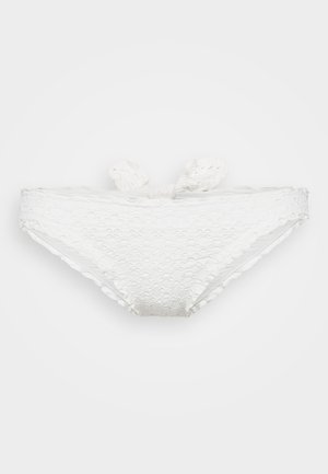 Bela bikinijska spodnjica iz teksturirane tkanine z cvetličnim vzorcem, z nastavljivimi kravaticami na vsaki strani in brezšivno zasnovo.