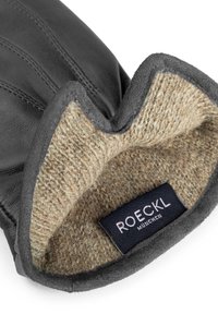 Schwarzer Lederhandschuh mit weichem, beigem Wollfutter. Verfügt über ein gesticktes Design an der Außenseite und ein Etikett mit der Aufschrift "ROECKL MÜNCHEN."