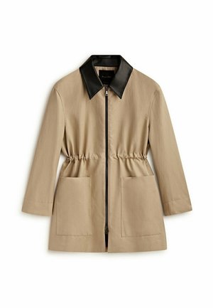 Beige jacket with a black leather collar, zip closure, elastic waist, and two front pockets. Smooth texture, tailored design.