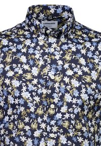 Navy blue relaxed fit shirt with button-down collar, featuring a dense floral pattern in white, light blue, and light brown shades.