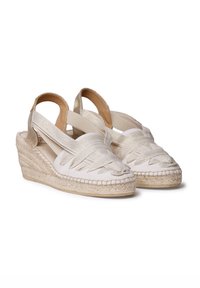 White espadrille wedge sandals with a braided design, elastic straps, and a jute rope sole. Smooth texture, subtle shine accents.