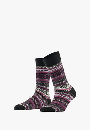 Gestrickte Socken mit einem schwarzen Grund, verziert mit einem geometrischen Muster in Pink, Weiß und Grau, abgerundet mit einem Rippenbund.