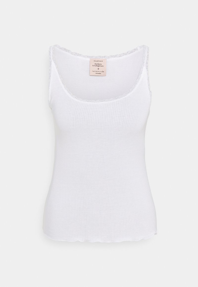 Vit ribbad tanktopp med en vågig spetskant längs halsringningen och ärmhålen. Har en liten märkesetikett på baksidan.