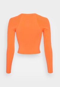Langärmliges, gekürztes Oberteil aus leuchtend orange geripptem Stoff. Verfügt über eine figurbetonte Silhouette und ein nahtloses Schulterdesign. Glatte Textur.