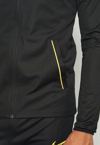 Nike Performance M NK DRY ACD21 TRK SUIT K - Fato de treino - black/laser orange