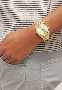 Nixon Uhr - gold-coloured