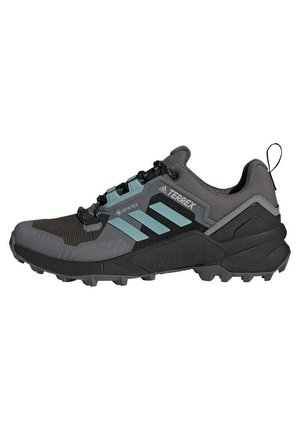 Schwarze und graue Trailschuhe mit einer strukturierten Oberseite, blauen Akzenten und einer robusten Laufsohle fürgriff. Ausgestattet mit GORE-TEX für Wasserdichtigkeit.