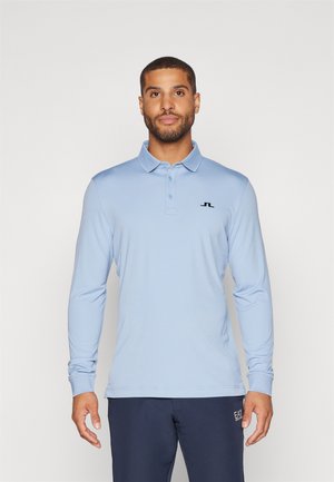 Light blue long-sleeve polo shirt made of smooth fabric, featuring a three-button placket and a small black logo on the chest.