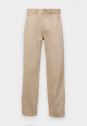 Beige denim jeans with a straight leg design, featuring front pockets, a metal button closure, and subtle texture.