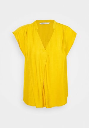 Blusa gialla a maniche corte con scollo a V e dettagli plissettati. Realizzata in un tessuto liscio e testurizzato. Caratterizzata da una vestibilità comoda e da un design drappeggiato.