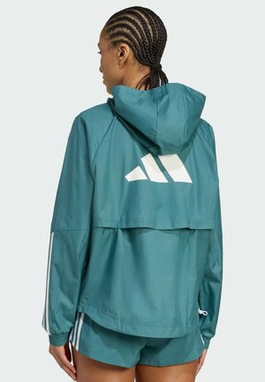Teal windbreaker jacket with a hood, featuring a white logo on the back and white stripes on the sleeves. Lightweight, smooth texture.