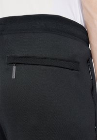 Sergio Tacchini MORET PANTS - Treniņtērpa apakšdaļas - black
