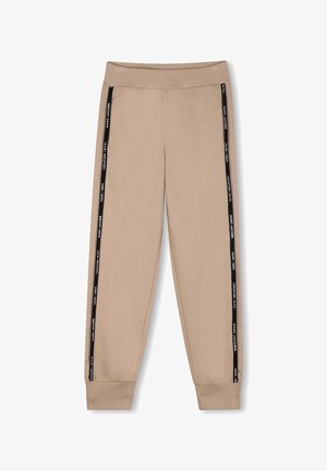 Beige sweatpants met zwarte zijstrepen met tekst. Geribbelde tailleband en boorden, gemaakt van zacht, rekbaar materiaal.