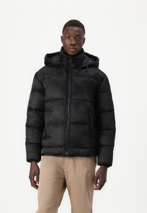 Black padded jacket with a glossy finish, featuring a zip front, hood, and subtle logo pattern. Lightweight with a boxy fit.