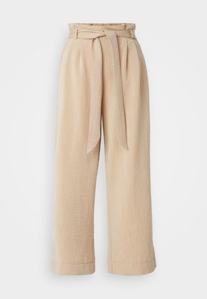 Beige wide-leg trousers with a belted waist, made of textured fabric. Features a front pleat and a smooth finish along the hem.