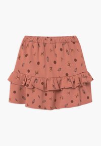 Roze katoenen rok met een ruchesrand, met een herhaald patroon van bladeren en stippen in bruine en gele tinten. Elastische tailleband.