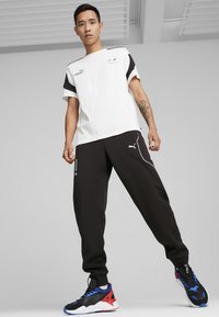Puma Treniņtērpa apakšdaļas - black