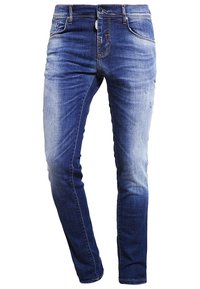 Tight jeans av denim, med en medelblå färg och en bleknad gradienteffekt, fem fickor och dragkedja.