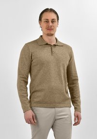 Lichtbruine longsleeve polo-shirt met een kraag en een drie-knopenlijst. Gemaakt van zacht, gestructureerd materiaal.