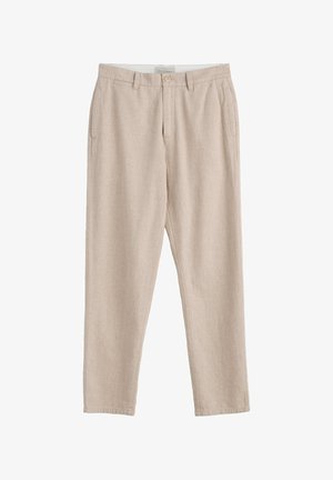 Beežid sirge lõikega püksid esikinnise ja tõmblukuga, vööaasade ning küljetaskutega, valmistatud kergest kangast.