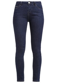 Tmavě modré skinny džíny vyrobené z denimu, s předním zapínáním na knoflík, čtyřmi kapsami a minimálními švy.