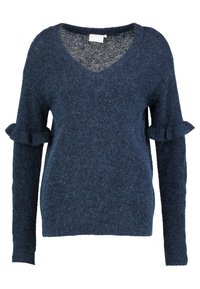 Donkerblauwe wollen trui met een V-hals, lange mouwen en gezeefde accenten bij de manchetten. Zachte textuur, losse pasvorm.
