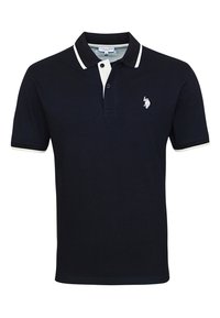 Navy polo shirt made of cotton, featuring white collar and sleeve accents, two-button placket, and small embroidered logo on the chest.