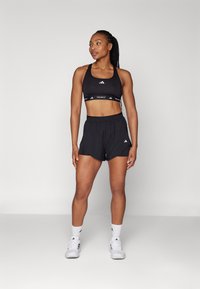 adidas Performance POWERREACT TECHFIT - Sport-bh met medium support - black