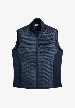 Mouwloos navy blauw doorgestikt vest met volledige ritssluiting aan de voorkant en opstaande kraag, met rekbare zijpanelen van stof.