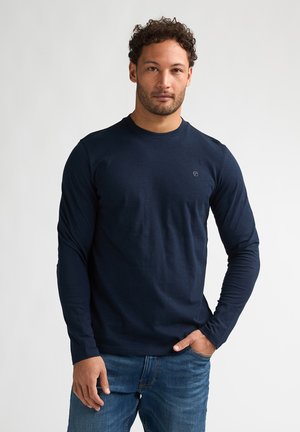 - Bluzka z długim rękawem