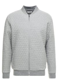 Giacca bomber trapuntata grigia con zip frontale, collo, polsini e orlo a costine. Realizzata in tessuto morbido e strutturato con un motivo sottile.