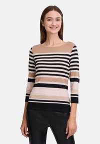 Gestreiftes Langarmoberteil in Beige, Schwarz und zartem Pink. Mit rundem Ausschnitt und figurbetontem Schnitt, aus weichem, dehnbarem Stoff gefertigt.