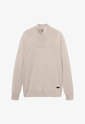 Lichtbeige pullovertrui met een kwart-rits kraag, geribbelde halslijn en lange mouwen. Kenmerkend is een kleine zwarte accenten aan de zoom.