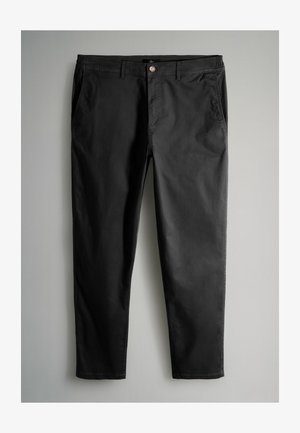 Mustad chinosid, valmistatud kergest puuvillasegust. Omavad kahte esimest taskut ja nööpidega sulgemist. Sirge säärega disain, millel on sile tekstuur.