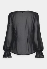 Schwarze durchsichtige Bluse mit langen, gepufften Ärmeln und Rüschenmanschetten. Hat einen abgerundeten Saum und eine dezente Textur. Minimalistisches Design.